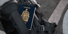 Canadian passport with luggage.