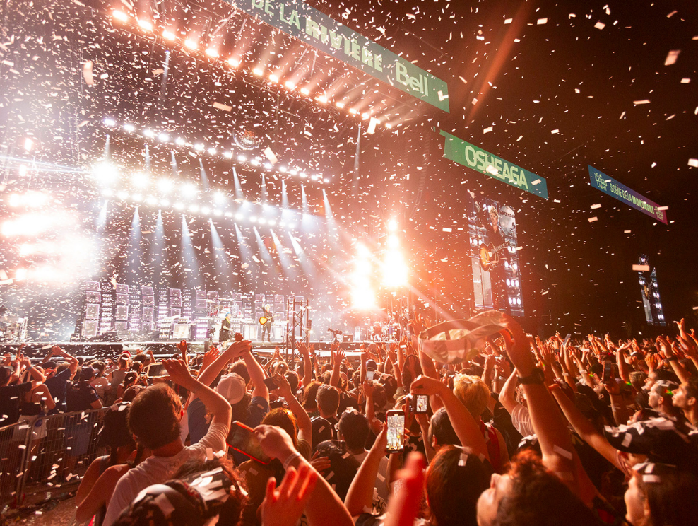 The crowd roars during an evening show at Osheaga.